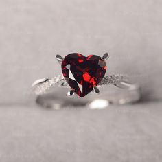 ◆ The ring is handcrafted from sterling silver and decorated with a dazzling 8*8 mm Garnet and CZs. It is suitable for engagement/anniversary/daily occasion. ◆ Production Description: Main stone Type: Garnet Main Stone Shape: Heart Cut Main Stone Size: 8*8 mm(2.44ct) Side stone: CZ Metal: 925 Sterling silver - Other options available in the drop down menu ◆ Customization: √Free for Add Engraving √Other Metal Type Available √Other Gemstones & Shapes Available √Personalization Requests Availab Moissanite Heart Cut Diamond Ring For Proposal, Heart Cut Moissanite Diamond Ring For Proposal, Diamond Heart Cut Ring For Proposal, Valentine's Day Silver Heart Birthstone Ring, Heart-shaped White Gold Birthstone Ring For Valentine's Day, Valentine's Day Gift Rings With Cubic Zirconia, Red Diamond Heart Ring For Anniversary, Fine Jewelry Solitaire Diamond Ring For Valentine's Day, Silver Cubic Zirconia Birthstone Ring For Valentine's Day