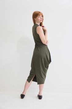 Turn heads in this chic sleeveless dress and its flattering silhouette. Pair with your favorite heels or dress down with casual sneakers Modern Stretch Sleeveless Dress, Modern Sleeveless Stretch Dress, Chic Stretch Midi Dress With Asymmetrical Hem, Modern Green Summer Dress, Sleeveless Stretch Asymmetrical Spring Dress, Spring Sleeveless Stretch Asymmetrical Dress, Spring Sleeveless Asymmetrical Stretch Dress, Chic Asymmetrical Stretch Sleeveless Dress, Summer Stretch Maxi Dress For Work