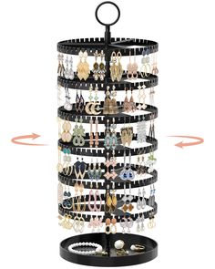 a jewelry rack with several rows of earrings hanging from it's sides and an arrow pointing to the top