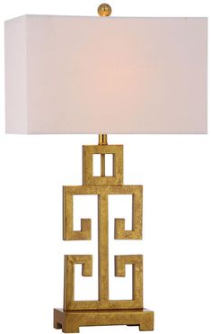 a gold lamp with a white shade on it's base and a square light fixture in the middle