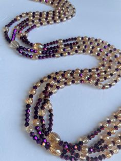 Double Strand Waist Bead, a stunning blend of purple crystal glass beads with elegant gold and brown accents. Why You'll Love It: Exquisite Sparkle: Beautiful purple crystal glass beads create a radiant, eye-catching shimmer. Elegant Accents: Gold and brown crystal glass beads add a touch of luxury and sophistication. Perfect Fit: The adjustable double strand design ensures comfort and a secure fit for all body types. Cultural Beauty: This piece reflects the rich heritage of Ivorian craftsmanshi Cultural Beauty, Wearing Purple, Strong Hand, Purple Crystal, Purple Crystals, Gold Accents, Crystal Glass, Trend Setter, Design Crafts