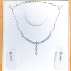 Radiant White Gold Diamond Necklace Set - the perfect addition to any sophisticated ensemble. Crafted from 18k white gold and weighing 24.1 grams, this piece features stunning round diamonds with a total weight of 2.96ct, set in a beautiful 17.5" necklace with a 1.25" drop length. It also comes with matching earrings with a length of 1.25" and screw backs for secure wearing. The lobster lock ensures this set stays safely in place, making it the perfect accessory for any occasion. PRODUCT DETAILS Elegant White Gold Jewelry Sets With Brilliant Cut, Fine Jewelry Platinum Bridal Necklace With Diamond Accents, Fine Jewelry Bridal Necklace With Diamond Accents In Platinum, Dazzling White Gold Jewelry Set With Brilliant Cut, Classic Diamond Jewelry Set With Prong Setting, Diamond White Platinum Bridal Necklace With Single Cut Diamonds, White Gold Diamond Jewelry Sets With Prong Setting, White Gold Prong Setting Jewelry Sets For Formal Occasions, Exquisite White Gold Diamond-cut Jewelry Set