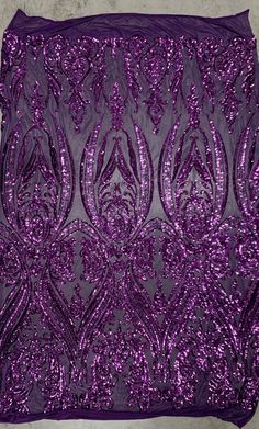 purple sequined fabric on concrete background