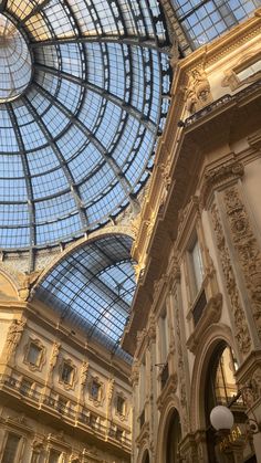 the inside of a building with glass roof