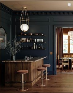 a kitchen with blue walls and wooden floors