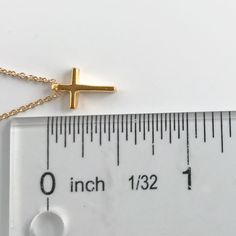 This tiny gold cross necklace is a classic addition to your layering necklaces. This minimalist necklace is also perfect by itself. - The cross charm is gold plated over sterling silver and measures approximately 12 mm in length or 1/2 inch. The dainty chain is 14k gold fill. This cross necklace is available in lengths from 14 - 20 inches. The model is wearing a 16 inch length. - Your new tiny cross necklace will come in a box, ready for gift giving. More Christian jewelry https://www.etsy.com/s Dainty Cross Necklace With Delicate Chain For Everyday, Dainty Everyday Cross Necklace With Delicate Chain, Adjustable Gold Cross Pendant Necklace, Simple Everyday Cross Pendant Necklace, Dainty Cross Necklace For Everyday, Dainty Yellow Gold Cross Necklace For Everyday, Simple Everyday Cross Necklace, Minimalist Gold Cross Necklace, Minimalist Cross Charm Necklace With Delicate Chain