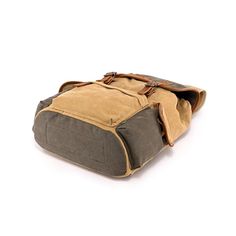 a brown and grey bag with two handles on it's side, sitting against a white background