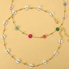 Summer Multi-Beaded Flower Charm Necklace, a vibrant accessory to brighten up your look for the sunny days ahead! This exquisite necklace boasts a delightful arrangement of colorful beads intricately woven together, culminating in a charming floral centerpiece. Each bead radiates summer vibes, bringing a burst of joy and style to any outfit. DIMENSIONlength: 15"ext: 3" Ball Chain Extclasp: Lobster Clawmetal finish: Gold Platedproduct: Lead & Nickel Compliantanti-tarnish: Double E-coating Flower-shaped Colorful Beaded Necklaces For Summer, Colorful Flower-shaped Beaded Necklaces For Summer, Summer Flower-shaped Beaded Necklaces With Colorful Beads, Trendy Multicolor Flower Necklace For Summer, Trendy Multicolor Summer Flower Necklace, Beaded Multicolor Flower Necklace For Beach, Colorful Beaded Flower Necklace For The Beach, Colorful Beaded Flower Necklace For Beach, Trendy Multicolor Flower Necklace With Colorful Beads