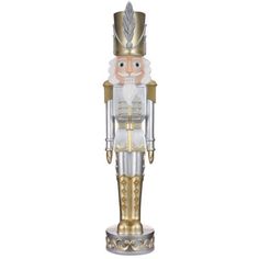 a gold and silver nutcracker statue on a white background