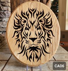 a wooden sign with a lion's head on it sitting on top of a tile floor