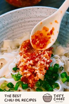 a spoon full of chili oil and noodles in a bowl with the title, the best chili oil recipes