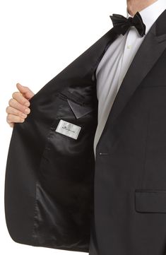 Fine wool and handsome satin trim define a clean, tailored tuxedo that's ready for elegant evenings and special occasions. Jacket has peaked lapels Partially lined 100% wool Dry clean Made in Canada Classic Business Silk Outerwear, Classic Silk Business Blazer, Classic Silk Blazer For Business, Classic Silk Outerwear For Business, Classic Silk Sport Coat, Classic Silk Suits With Notch Lapel, Elegant Sport Coat With Hidden Button Closure, Classic Formal Tuxedo With Structured Boning, Tailored Classic Outerwear For Black-tie Events