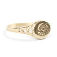 Viola's Treasure possesses the spirit of a well-worn pinkie ring, inherited by the favorite daughter of a dashing patriarch who once scaled Kilimanjaro and showed Hemingway the ways of Paris. Made to be handed down through the generations. Gorgeously hand-engraved with a single initial.�See Details for item specifics.Financing options available in partnership with�Affirm. Luxury Engraved Ring With Single Cut Diamonds As Gift, Luxury Signet Ring With Rose Cut Diamonds, Yellow Gold Engraved Diamond Ring, Timeless Diamond Engraved Ring With Polished Finish, Engraved Yellow Gold Diamond Ring In Fine Jewelry Style, Yellow Gold Diamond Engraved Ring Fine Jewelry, Timeless Yellow Gold Diamond Engraved Ring, Fine Jewelry Yellow Gold Signet Ring With Diamond Accents, Timeless Diamond Initial Ring With Polished Finish