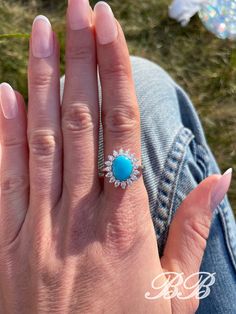 Big and beautiful sleeping beauty turquoise cabochon and 6A quality cubic zirconia sterling silver statement halo ring. This beautiful sleeping beauty cabochon is made from 100% natural sleeping beauty gemstone powder that has been hardened into a cab stone with clear resin.  Because these cabochons are a mixture of the natural powdered stone, they will have a uniform look and you don't have to worry about imperfections or inclusions in the turquoise stone.  The cab you get will look like the ph Turquoise Sterling Silver Jewelry With Center Stone, Gift Turquoise Ring With Diamond Center Stone, Gift Turquoise Diamond Ring With Center Stone, Fine Jewelry Turquoise With Halo Setting, Luxury Turquoise Jewelry With Center Stone, Turquoise Jewelry With Halo Setting For Gift, Turquoise Jewelry With Halo Setting As A Gift, Luxury Turquoise Diamond Ring With Center Stone, Oval Turquoise Ring For Wedding