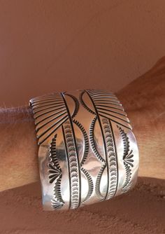 "XL NAVAJO BRACELET, Signed \"L B\" which is the hallmark of renowned Navajo Artist Lee Brown & Stamped \"Sterling\" 7 1/4\" inside circumference including a 1 1/8\" Gap 83.2 Grams 1 3/4\" Wide" Vintage Navajo Jewelry Leather, Vintage Navajo Jewelry Gold, Classic Etched Bracelet Jewelry, Elegant Stamped Bangle Jewelry, Elegant Wide Band Stamped Jewelry, Unique Stamped Jewelry For Formal Occasions, Luxury Engraved Wide Band Jewelry, Collectible Wide Band Engraved Jewelry, Collectible Engraved Wide Band Jewelry