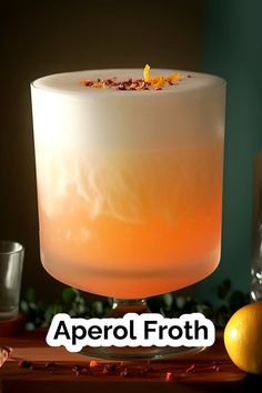 an orange and white drink with the words aperol froth on it's side