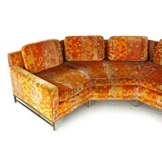 an orange and yellow couch with matching cushions