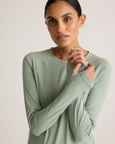 On the move? Meet our Ultra-Form Long Sleeve Top. Made with a relaxed fit, this top allows for unrestricted movement so you can focus on your workout reps instead of how your shirt is shifting around. An easy layering piece, it's buttery soft with 4-way stretch and plenty of performance features, including quick-dry, moisture-wicking, and anti-microbial technology.  | Quince | Women's Ultra-Form Long Sleeve Top in Aloe, Size XS, Nylon/Spandex Relaxed Fit Crew Neck Activewear For Light Exercise, Versatile Solid Tops For Yoga, Versatile Solid Color Yoga Tops, Moisture-wicking Relaxed Fit Athleisure Top, Green Functional Tops With Thumbholes, Casual Relaxed Fit Tops For Light Exercise, Functional Relaxed Fit Crew Neck Top, Relaxed Fit Functional Crew Neck Top, Sporty Crew Neck Top With Thumbholes