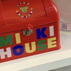 a red box with the words milk house painted on it