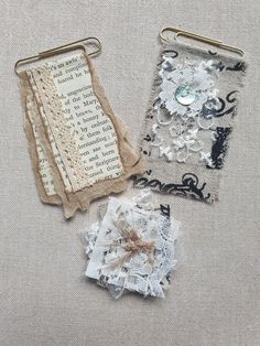 three pieces of fabric and lace are on the table next to each other, one with a button