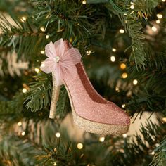 a pink shoe ornament hanging from a christmas tree