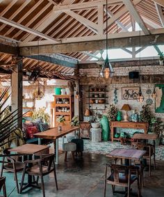 a room filled with wooden tables and chairs