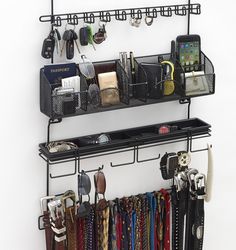 a rack that has several items on it and hanging from the wall with hooks to hold them