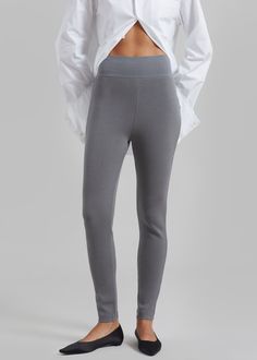 Color: Grey Midweight stretch knit fabric Slim fit High rise Elasticated waist Slip on style Unlined 72% Rayon 28% Polyester Hand Wash Cold Imported High Stretch Bottoms With Elastic Waistband For Winter, Stretch Pants With Ribbed Waistband, Elegant Stretch Pants With Ribbed Waistband, Elegant Fitted Bottoms With Ribbed Waistband, Stretch Bottoms For Winter Loungewear, Stretch Bottoms For Loungewear In Winter, Winter High Stretch Pants With Elastic Waistband, Versatile Comfort Stretch Elastane Tights, High Stretch Pants With Elastic Waistband For Winter