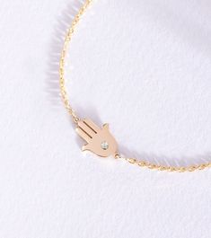 Diamond Hamsa Bracelet 14k 18k Solid Gold, Birthstone Fatima Hand Bracelet, Dainty Diamond Lucky Hamsa Bracelet, Birthday Gift For Her, Gift For Christmas, Good Luck Bracelet  Material: Solid real Gold (not gold filled or gold plated) Gold Karat: 14k (585), 18k (750) Gold Color: Yellow Gold, White Gold, Rose Gold Height of the Hamsa: 11.00 mm Width of the Hamsa: 9.20 mm The size of the hamsa may differ slightly due to handwork. Diamond Color: G-H Diamond Clarity: SI Diamond Weight: 0.03 ct  Brac Dainty Gold Plated Diamond Bracelet As A Gift, Dainty Gold Plated Diamond Bracelet For Gift, Dainty Gold-plated Diamond Bracelet Gift, Adjustable Gold-plated Diamond Bracelet For Gifting, Adjustable Gold-plated Diamond Bracelet As Gift, Adjustable Gold-plated Diamond Bracelet Gift, Symbolic 14k Gold Bracelet For Gifts, Fine Jewelry Gold Bracelet Tarnish Resistant, 14k White Gold Diamond Bracelet Gift