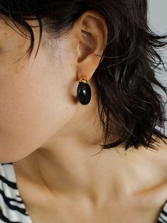 Indulge in the irresistible charm of our Black Onyx Moon Huggie Earrings! Crafted with sleek black onyx stones set in a moon-shaped huggie design, these earrings will add a touch of elegance and mystique to any outfit. Elevate your style and enchant those around you with these stunning earrings. Metal:Metal: 18K Recycled Gold Plated Vermeil on Recycled Sterling Silver/Recycled Sterling Silver Gemstones:Black Onyx Dimensions: length 27mm Weight: 8g each Chic Black Round Earrings, Black Hoop Earrings For Everyday, Black Everyday Hoop Earrings, Everyday Black Hoop Earrings, Chic Black Hoop Jewelry, Chic Black Earrings With Black Enamel, Everyday Black Single Hoop Earring, Classic Small Hoop Earrings In Black, Small Black Classic Hoop Earrings