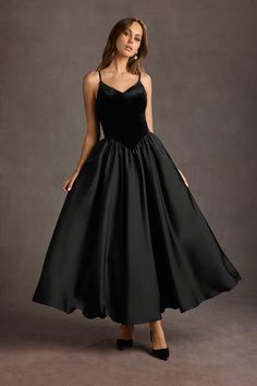 Our Pandora Dropped Waist Maxi Dress will ensure you are on the best-dressed list at your next function. This stunning velvet satin style features a dropped waist design and a voluminous pleated maxi skirt. The perfect style for your next special occasion or an upscale event. Black Tie Inspo Women, Formal 60s Dress, Wedding Guest Dresses Modest, Drop Waist Dress Formal, Old Hollywood Black Dress, Black Tie Winter Wedding Guest Dress, Drop Waist Prom Dress, Grunge Formal Dress, Christmas Ball Dresses