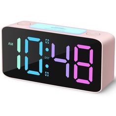 the alarm clock is pink and has blue numbers on each side, as well as two different colors