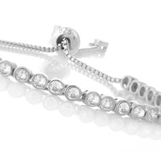 Silver bracelet with simulated diamond stones. This bridal tennis bracelet or dazzling sophistication river of round crystals bracelet made of 925 sterling silver, finished dangling two brightness stones and adjustable round clasp. This celebrity inspired luxury precious stone bridal jewelry truly fabulous and trendy piece is perfect for any occasion. Hand Evil Eye, Twisted Bracelet, Evil Eye Earrings, Mesh Bracelet, Eye Earrings, Evil Eye Necklace, Evil Eye Bracelet, Hamsa Hand, Cross Charms