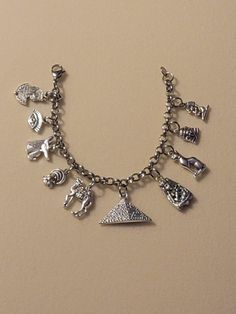 Silver Egyptian Chain Bracelet comes with all charms shown in the first picture.  Bracelet is 7.5 inches long, however I can make any size you need.  Just be sure to note what size you need in the message to seller when placing your order.   And we will follow your directions.  Please feel free to message us with any questions you may have.  Thank you so much! Symbolic Dangle Bracelets With Charms, Spiritual Metal Charm Bracelet, Symbolic Charm Bracelet With Dangling Charms, Symbolic Dangle Charm Bracelet, Nickel Free Metal Charm Bracelet - Spiritual Style, Nickel-free Silver Bracelets As Souvenir, Symbolic Metal Charm Bracelet With Dangling Charms, Spiritual Metal Charm Bracelet With Dangle, Silver Nickel-free Bracelet Souvenir