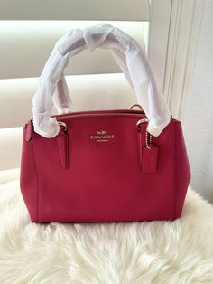 NWT COACH MINI CHRISTIE CARRYALL IN CROSSGRAIN LEATHER F57523 Bright pink & Gold $350. Details Crossgrain leather Inside zip, cell phone and multifunction pockets Zip-top closure, fabric lining Handle with 5 3/4" drop Strap with 23 1/2" drop for shoulder or crossbody wear 10 1/2" (L) x 7" (H) x 4" (W) 100% authentic and perfect condition! Women's Bags, Zip Top, 7 H, Pink Gold, Bright Pink, Pink And Gold, Fashion Bags, Bags Handbags, Cell Phone