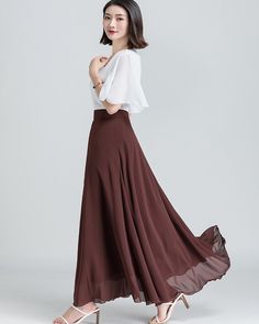 * A long skirt with fixed waist and side zipper. * A-line shape and wide hem, can make you look more taller and slimmer. * Made of pearl chiffon and fully lined. * Can custom make waist size and skirt length. * Material: 100% polyester * Size: True to US size, US 0-US 20 are available, you can let us know your usual size and height in your order. * Shipping: Free shipping Processing time : 5-7 Business days Delivery time : 7-20 Business days Tracking number available If you need rush order or ex White Maxi Length Lined Skirt, White Lined Maxi Skirt, Chic A-line Flowy Maxi Dress, Elegant White Ruffled Maxi Skirt, White Flowy Maxi Length Skirt, Elegant White Wide Leg Maxi Skirt, Elegant White Chiffon Skirt, Flowy Wide Leg White Skirt, Flowy A-line Maxi Skirt