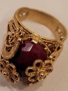 In beautiful vintage (used) condition. Clearly stamped. Gold over sterling Filigree setting with a large ruby. Please look at the pictures for details and condition or message me with any questions Ruby Ring, Ethnic Jewelry, Link Necklace, The Lion, Gold Beads, Rings Statement, Things I Want, Statement Rings, Lion