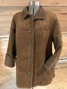 L.L. Bean milk chocolate brown faux shearling coat is petite Large. Patch pockets.  Soft and warm.    In excellent condition.  Underarm to underarm - 23" Sleeves:  20.5 Bottom of collar to hem - 30" Cozy Brown Outerwear With Button Closure, Brown Winter Fur Coat With Button Closure, Brown Sherpa Outerwear With Faux Fur Lining, Brown Sherpa Outerwear With Fleece Lining, Brown Fur Coat With Fleece Lining For Cold Weather, Brown Fur Coat With Fleece Lining For Winter, Brown Sheepskin Outerwear With Pockets, Brown Shearling Outerwear With Pockets, Brown Sherpa Outerwear For Cold Weather