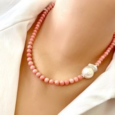 "A perfect summer accessory, this pink coral necklace is complimented with a white baroque pearl added to the side and finished with sterling silver components. MATERIALS: Pink coral beads 6.5mm Freshwater White baroque pearl  Sterling silver beads and lobster clasp Length is 18.\"inches [45cm] approx. All Loulia Pearl Jewelry orders are carefully packaged in a jewelry box with foam insert and secured with a ribbon for safe delivery. You will also get a beautiful jewelry pouch to store your piec Pearl Diamond Pendant, Hematite Jewelry, Pyrite Necklace, Pearl Lariat Necklace, Hematite Necklace, Baroque Pearl Necklace, Pearl Pendant Necklace, Short Necklace, Beach Jewelry