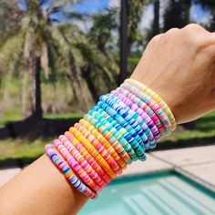 🛒Our preppy, colorful, and bright mixed clay bracelets make the perfect summer (and beyond) accessory! With bright clay heishi beads, you can create unique stacking bracelets to match any outfit. The perfect gift idea for someone special! 📦FREE SHIPPING on orders $35 or more to US shoppers 💎Care = We recommend: -Remove when sleeping -Allow perfumes and lotions to dry before wearing -Roll the bracelet gently on and off your hand instead of overly-stretching the bracelet -Keep away from moisture (although polymer clay itself is water resistant, to extend the life of your jewelry you should avoid wearing in the shower or bath, pool, ocean, or lake, or around water-based chemicals) 🧵Material = 6mm Polymer Clay Heishi Beads, 6mm Gold Metal Bead & Stretch Cord 🎨Color = 17 Mixed Color option Cheap Rainbow Heishi Beaded Bracelets, Clay Beaded Bracelets, Bracelets Preppy, Bracelets Heishi, Make Clay Beads, Colorful Preppy, Clay Bracelets, Clay Bead Necklace, Heishi Bracelet