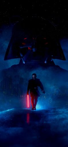 a man standing in front of a giant star wars poster with lights coming from it