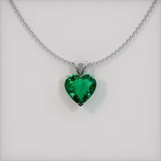 The pendant is entirely set in 18K white gold. The pendant features a beautiful, transparent 1.98 carat heart shape green emerald with the dimensions of 8.97 x 9.23 x 4.36 mm and a mixed brilliant cut. It has a clarity grade of slightly included (evaluated at eye level), vivid color saturation, and an excellent polish. The origin of this emerald is Zambia. #gift necklace #beautiful necklaces #necklace for her #accessories necklaces #necklace cute Luxury Emerald Necklace With Vvs Clarity As A Gift, Luxury Vvs Clarity Emerald Necklace As Gift, Luxury Exquisite Emerald Necklace For Gift, Luxury Teardrop Pendant Emerald Necklace, Luxury Emerald Round Pendant Necklace, Luxury White Gold Emerald Necklace With Round Pendant, Luxury Emerald Square Pendant Necklace For Gift, Luxury Emerald Teardrop Pendant Jewelry, Luxury Emerald Teardrop Pendant Necklace