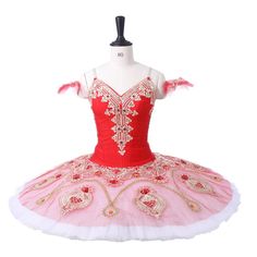 a red and white ballerina dress on a mannequin headdress,