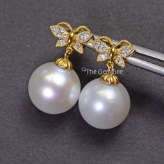 DESCRIPTION: Thank you for coming in! 18K solid yellow gold earrings with cute floral design and 12.5mm South Sea white pearls! Full of luster and elegance! ! It looks much much nicer on your ears! You will receive the exact pair of earrings in the pictures! WEIGHT: 7.95 Grams, 0.12 Carats of diamonds LENGTH: 0.88 inch MATERIAL: 18K Solid Yellow Gold, South Sea White Pearl, Diamonds Exquisite Yellow Gold Pearl Earrings For Anniversary, Exquisite Yellow Gold Pearl Earrings, Luxury Hallmarked Yellow Gold Pearl Earrings, Luxury Yellow Gold Akoya Pearl Earrings, Exquisite Yellow Gold Pearl Earrings For Gift, Luxury Yellow Gold Pearl Earrings With Elegant Design, Luxury Yellow Gold Pearl Earrings As Gift, Diamond Butterfly, Sky Blue Topaz