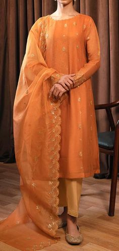 "Material: High-quality net fabric Design: long net shirt and dupatta Color Options: orange Occasion: Ideal for weddings, parties, or cultural events Features: Ready to wear, no hassle of stitching Comfortable and easy to wear Exquisite craftsmanship Care Instructions: Dry clean only for long-lasting beauty and durability. the color of the product in the photo might look slightly different in person due to factors like lighting and screen settings.\" \"Please note that sizes may vary based on the specific style of the item.\"" Designer Orange Sharara With Sheer Dupatta, Festive Orange Sharara With Sheer Dupatta, Orange Anarkali Set With Dupatta And Straight Kurta, Orange Chanderi Kurta With Sheer Dupatta, Orange Sharara With Sheer Dupatta For Diwali, Designer Orange Sharara With Chikankari Embroidery, Traditional Orange Sharara With Sheer Dupatta, Unstitched Orange Bollywood Anarkali Set, Orange Anarkali Set With Dupatta For Diwali