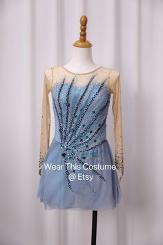 a dress on a mannequin with beading and sequins in blue