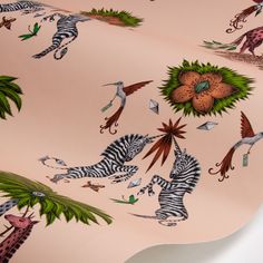 a pink wallpaper with zebras and giraffes on it