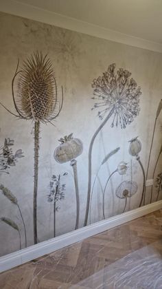 the wall is decorated with flowers and plants in greys, creams and browns