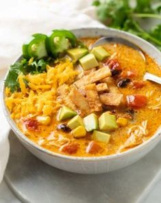 a white bowl filled with chicken and rice soup