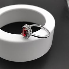 "Bloom Red Ruby Sterling Silver Ring, Ruby Ring, Ruby Jewellery, Diamond Ring, Engagement Ring, Promise Ring, Wedding Ring, July birthstone. Personally Designed Red Ruby ring, with 3 layers of 18ct white gold plated sterling silver, in a single solid band. white gold plated silver is fine (solid) sterling silver that is polished and dipped in white gold. It has a bright finish and it doesn't tarnish. This classically designed ring is made with Lab treated Red Ruby mined from Nepal. The process i Red Cubic Zirconia Birthstone Jewelry, Elegant Red Cubic Zirconia Rings, Red Cubic Zirconia Jewelry For Promise Ring, Red Garnet Cluster Promise Ring, Garnet Open Ring Jewelry For Wedding, Red Cubic Zirconia Promise Ring Jewelry, Red Cubic Zirconia Promise Ring, Red Open Diamond Promise Ring, Red Cubic Zirconia Gemstone Ring